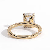 Emerald lab-grown diamond halo engagement ring in 18K (750) yellow gold, on white background 