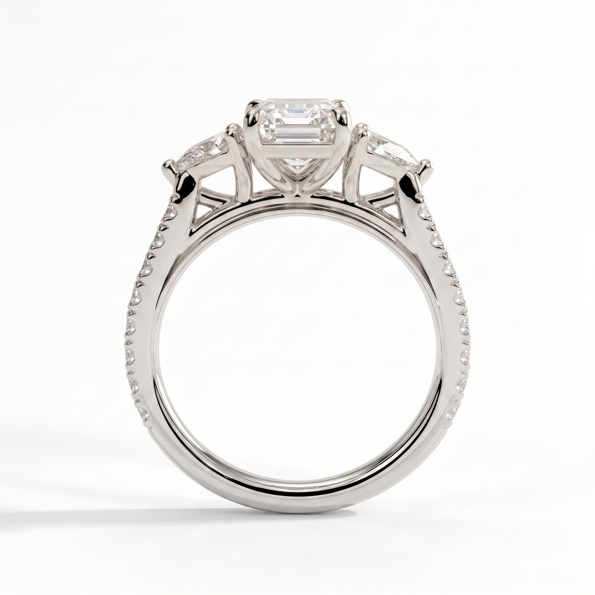 Emerald lab-grown diamond three-stone engagement ring in 14K (585) white gold, side profile 