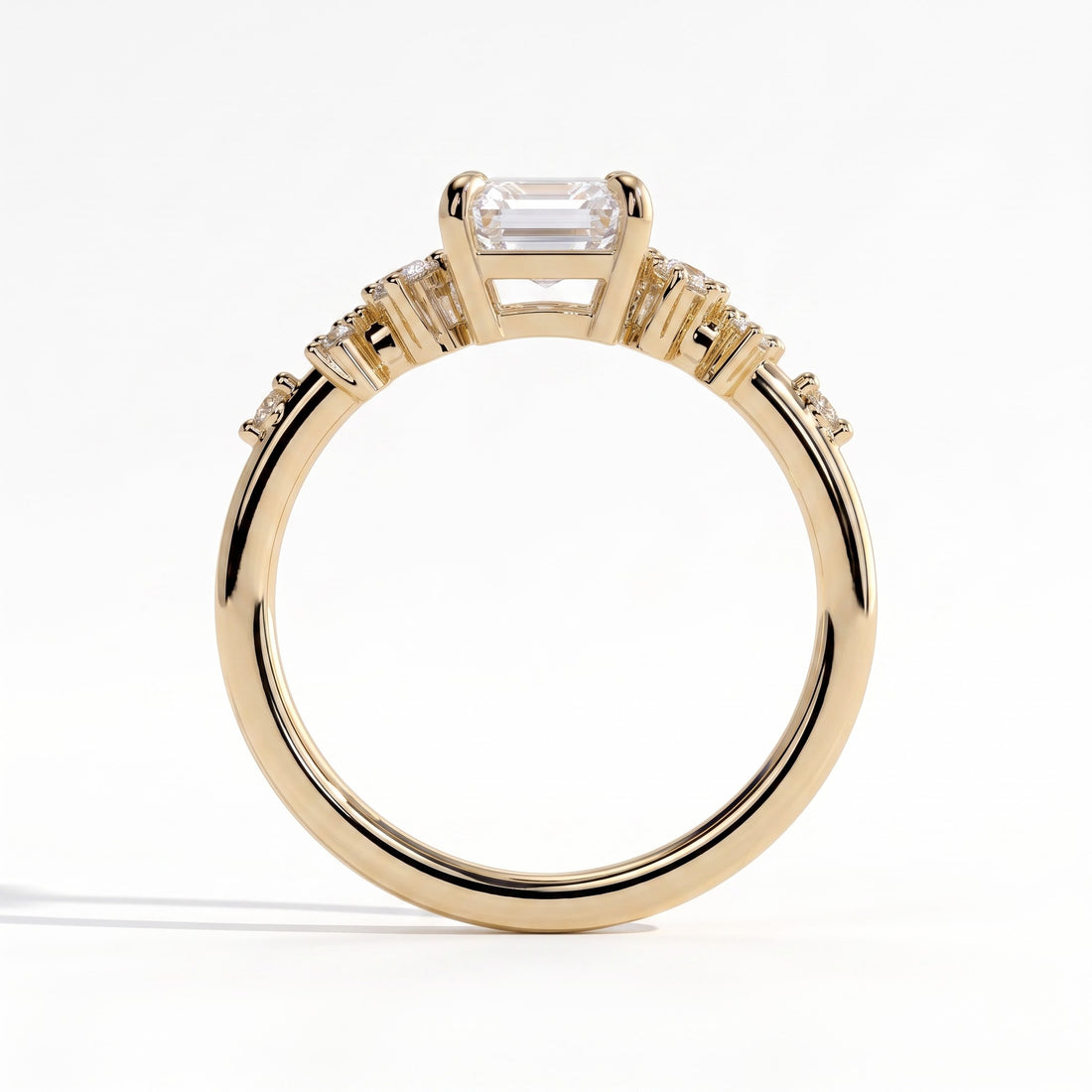 Emerald lab-grown diamond three-stone engagement ring in 14K (585) yellow gold, side profile 