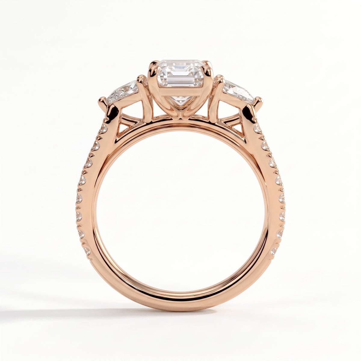 Emerald lab-grown diamond three-stone engagement ring in 14K (585) rose gold, side profile 