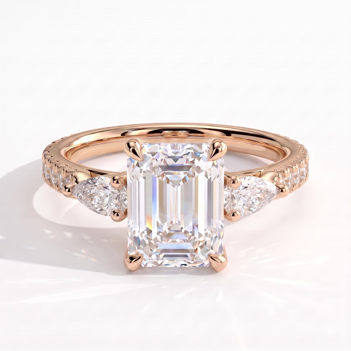 Emerald lab-grown diamond three-stone engagement ring in 14K (585) rose gold, front view 
