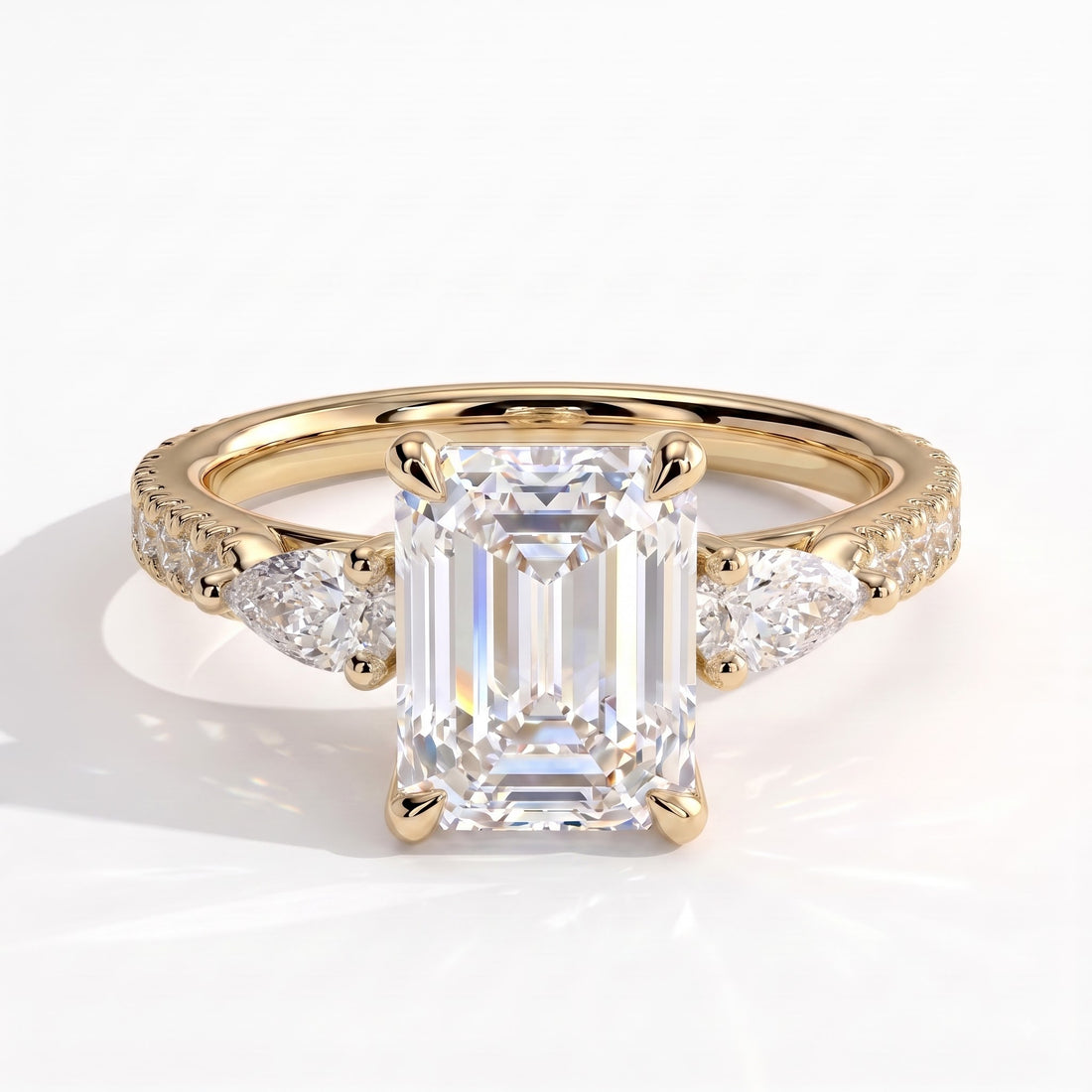 Emerald lab-grown diamond three-stone engagement ring in 14K (585) yellow gold, front view 
