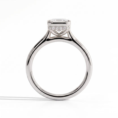 Emerald lab-grown diamond bezel-set halo engagement ring in 950 platinum, side profile 