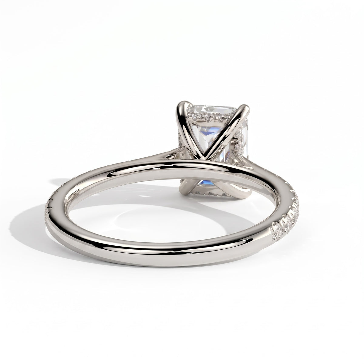 Emerald lab-grown diamond halo engagement ring in 950 platinum, on white background 