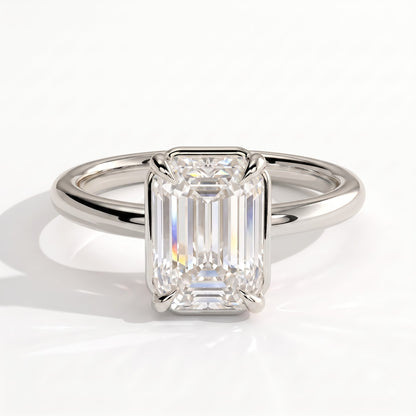 Emerald lab-grown diamond bezel-set solitaire engagement ring in 950 platinum, front view 
