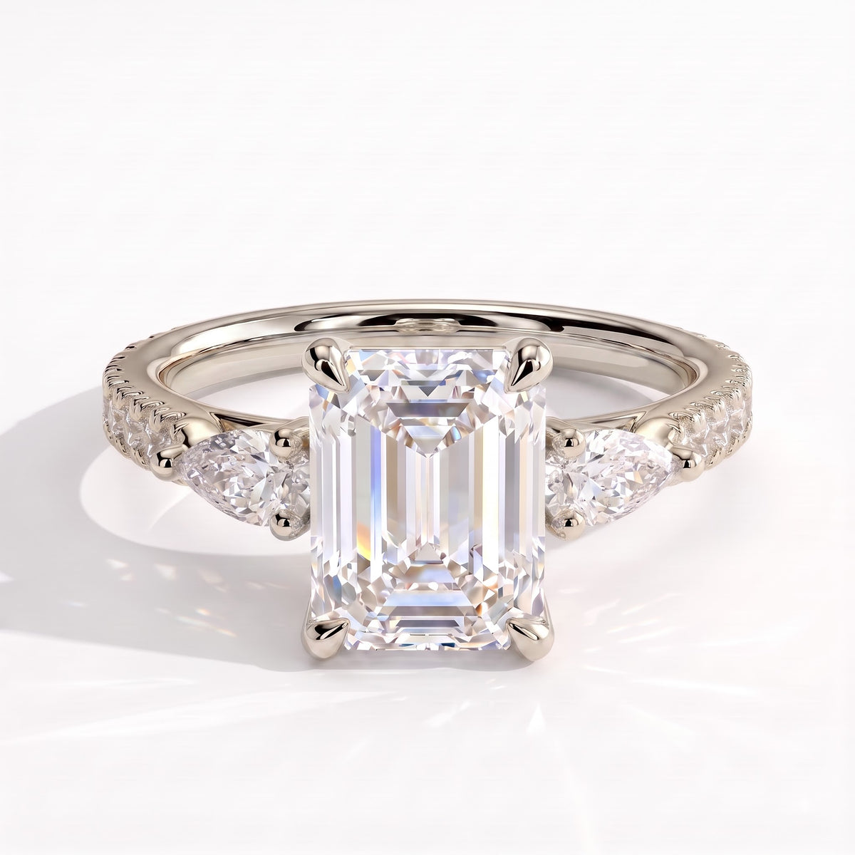 Emerald lab-grown diamond three-stone engagement ring in 18K (750) white gold, front view 