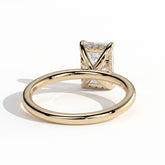 Emerald lab-grown diamond solitaire engagement ring in 14K (585) yellow gold, on white background 