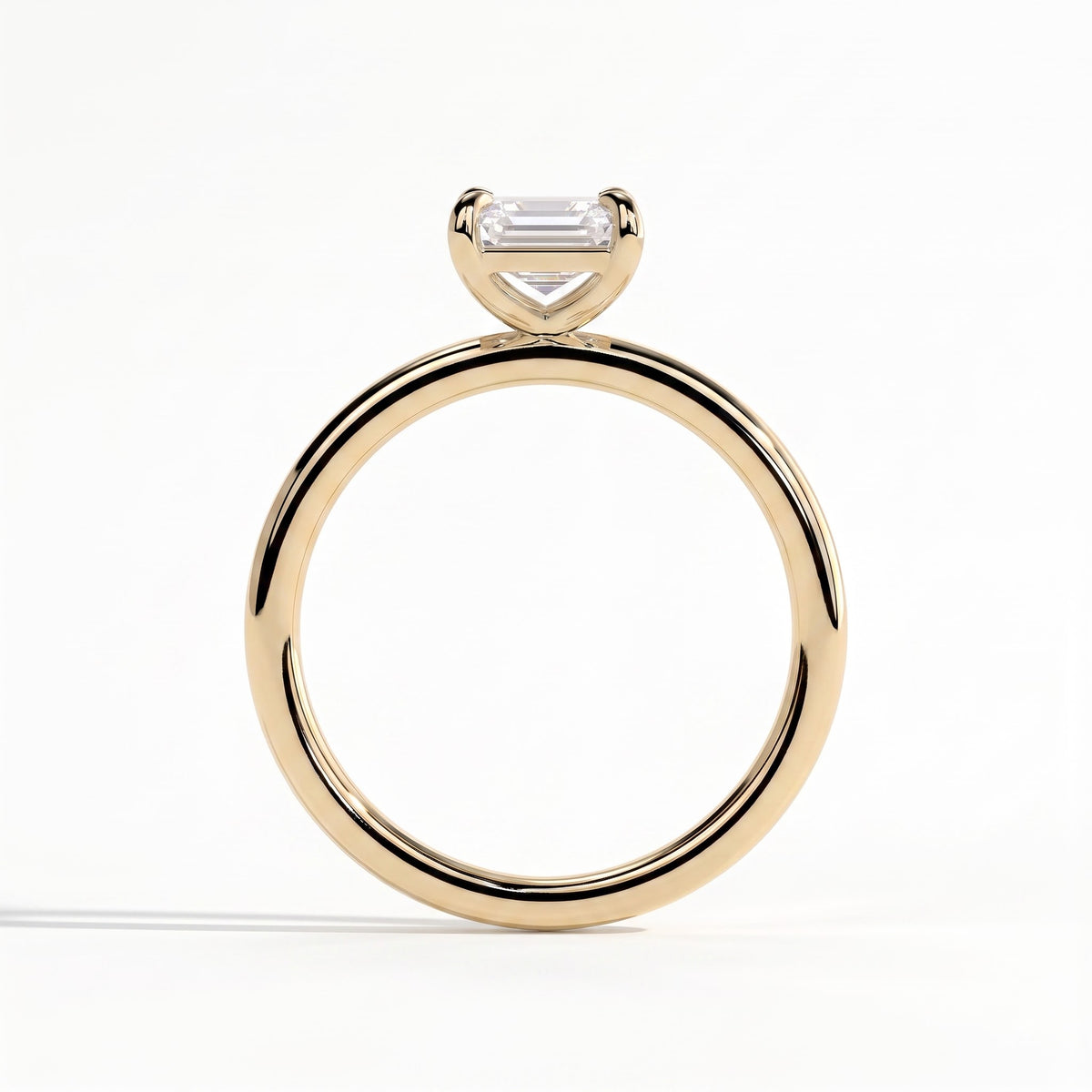 Emerald lab-grown diamond solitaire engagement ring in 18K (750) yellow gold, side profile 