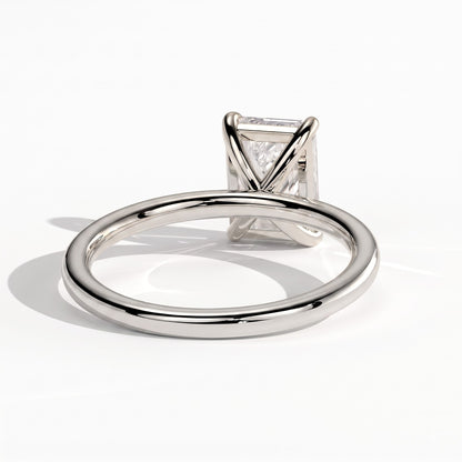 Emerald lab-grown diamond solitaire engagement ring in 18K (750) white gold, on white background 