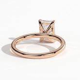 Emerald lab-grown diamond solitaire engagement ring in 18K (750) rose gold, on white background 