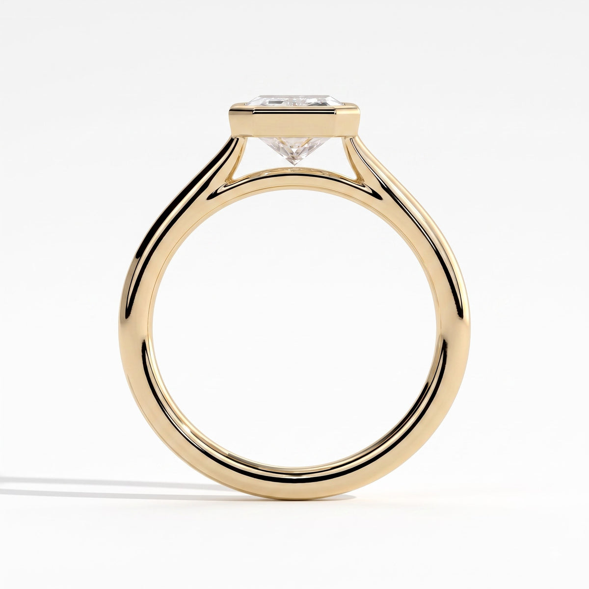Radiant lab-grown diamond bezel-set solitaire engagement ring in 14K (585) yellow gold, side profile 