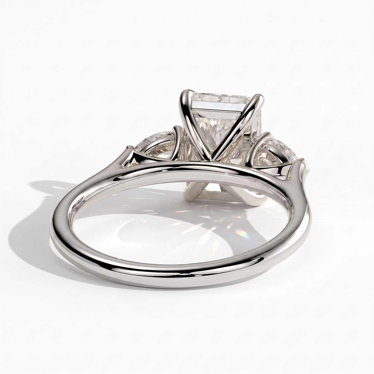 Radiant lab-grown diamond three-stone engagement ring in 14K (585) white gold, on white background 