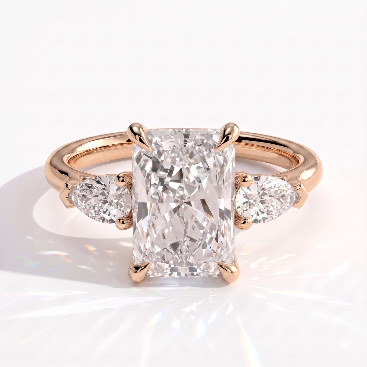 Radiant lab-grown diamond three-stone engagement ring in 14K (585) rose gold, front view 