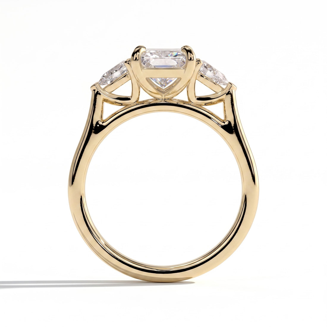 Radiant lab-grown diamond three-stone engagement ring in 14K (585) yellow gold, side profile 