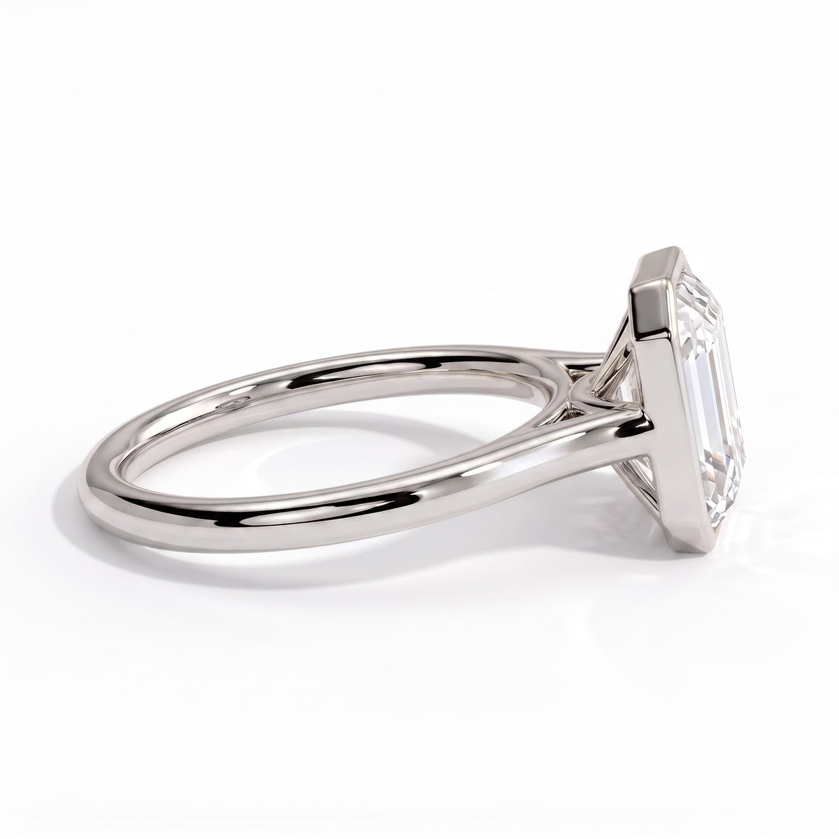 Emerald lab-grown diamond bezel-set solitaire engagement ring in 18K (750) white gold, detail view 