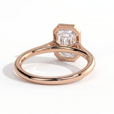 Emerald lab-grown diamond bezel-set solitaire engagement ring in 18K (750) rose gold, on white background 