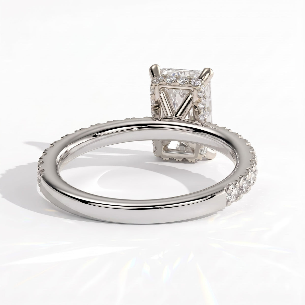 Radiant lab-grown diamond halo engagement ring in 18K (750) white gold, on white background 