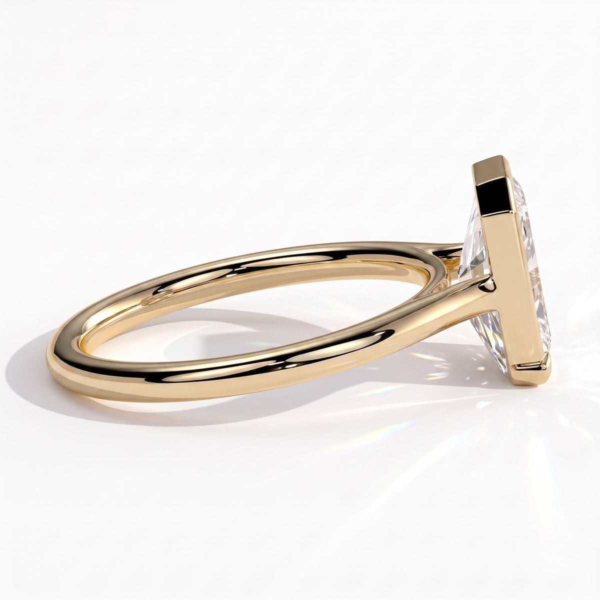 Radiant lab-grown diamond bezel-set solitaire engagement ring in 18K (750) yellow gold, detail view 