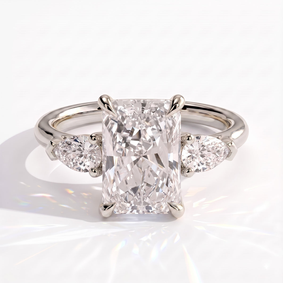 Radiant lab-grown diamond three-stone engagement ring in 950 platinum, front view 