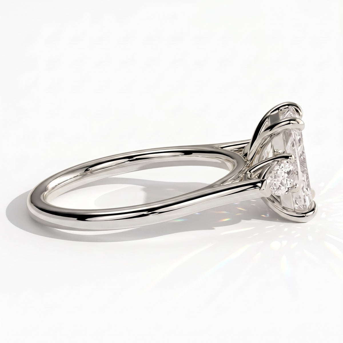 Radiant lab-grown diamond three-stone engagement ring in 950 platinum, detail view 