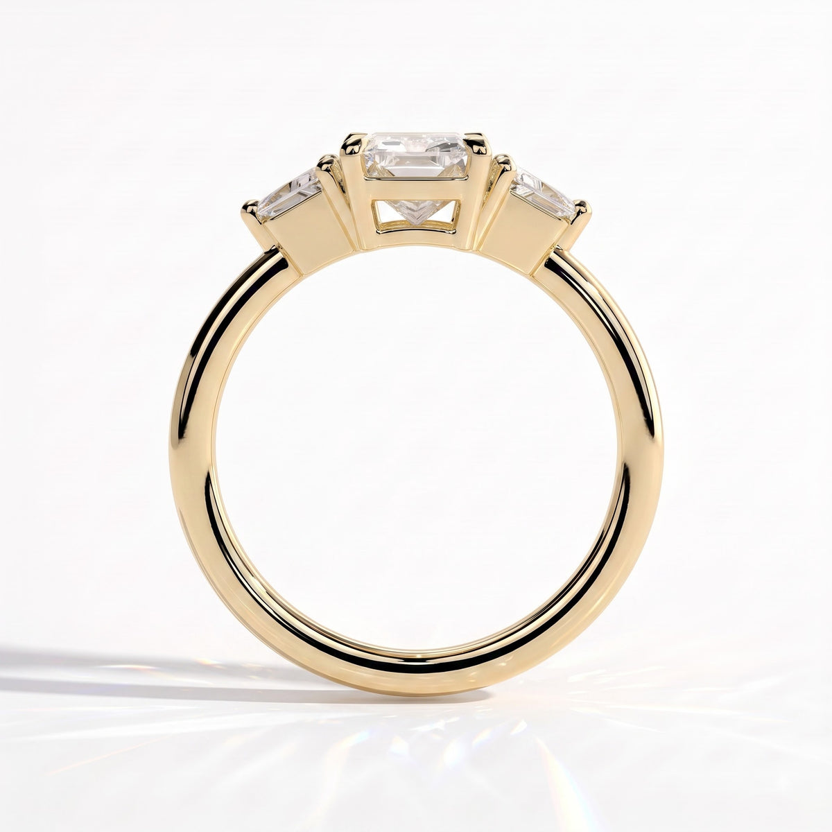Radiant lab-grown diamond three-stone engagement ring in 14K (585) yellow gold, side profile 
