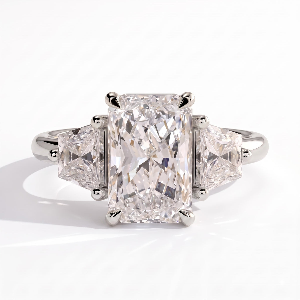 Radiant lab-grown diamond three-stone engagement ring in 14K (585) white gold, front view 