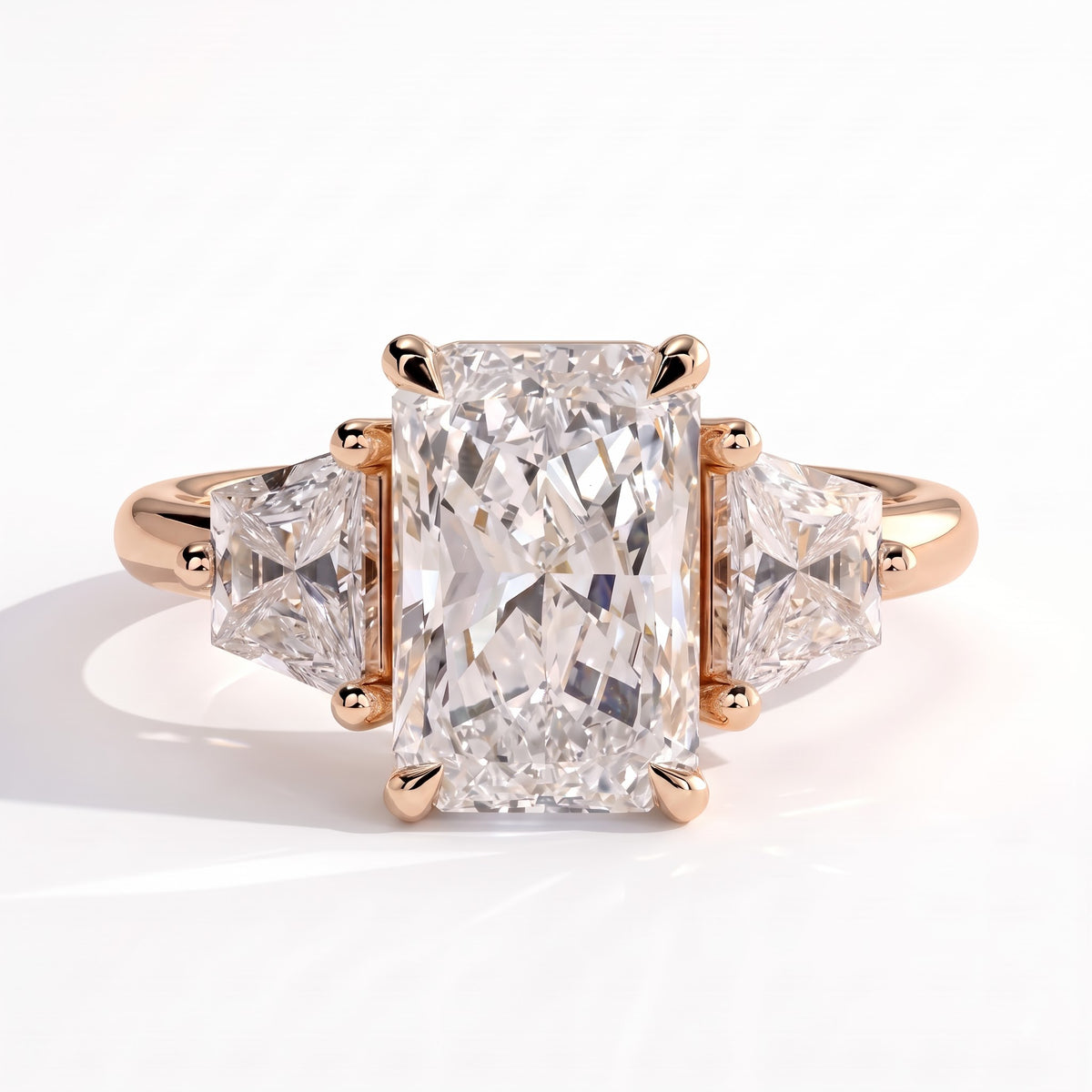 Radiant lab-grown diamond three-stone engagement ring in 14K (585) rose gold, front view 