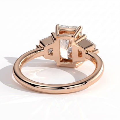 Radiant lab-grown diamond three-stone engagement ring in 18K (750) rose gold, on white background 