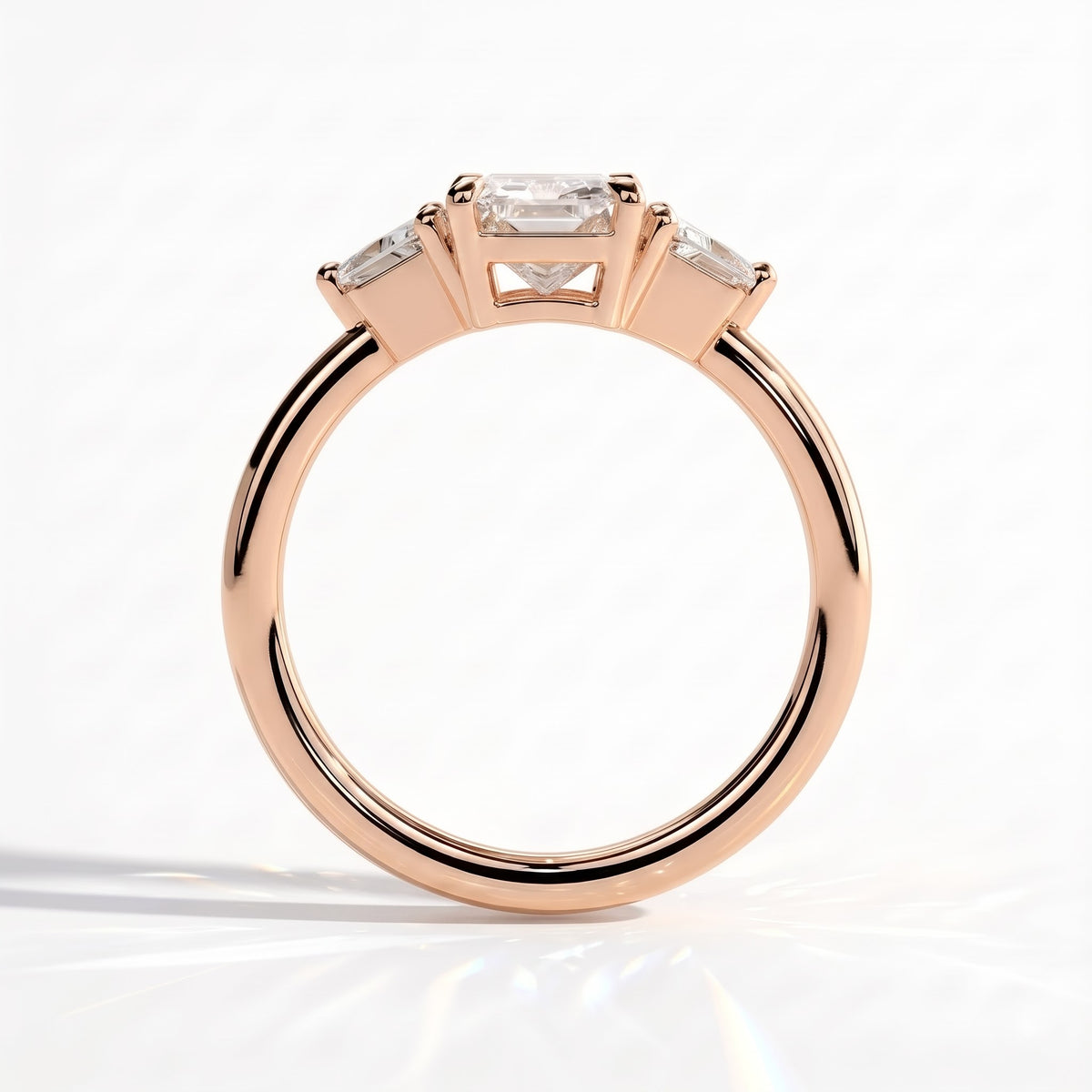 Radiant lab-grown diamond three-stone engagement ring in 18K (750) rose gold, side profile 