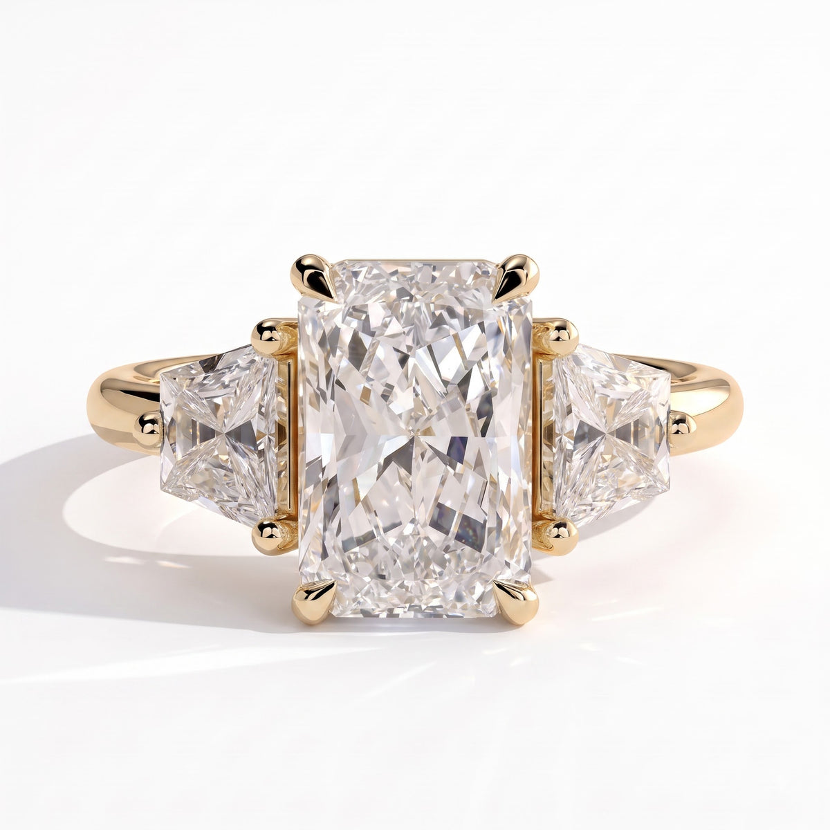 Radiant lab-grown diamond three-stone engagement ring in 18K (750) yellow gold, front view 