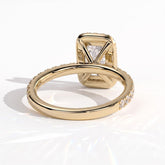 Radiant lab-grown diamond halo engagement ring in 14K (585) yellow gold, on white background 