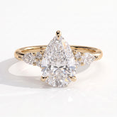 Pear lab-grown diamond halo engagement ring in 14K (585) yellow gold, front view 
