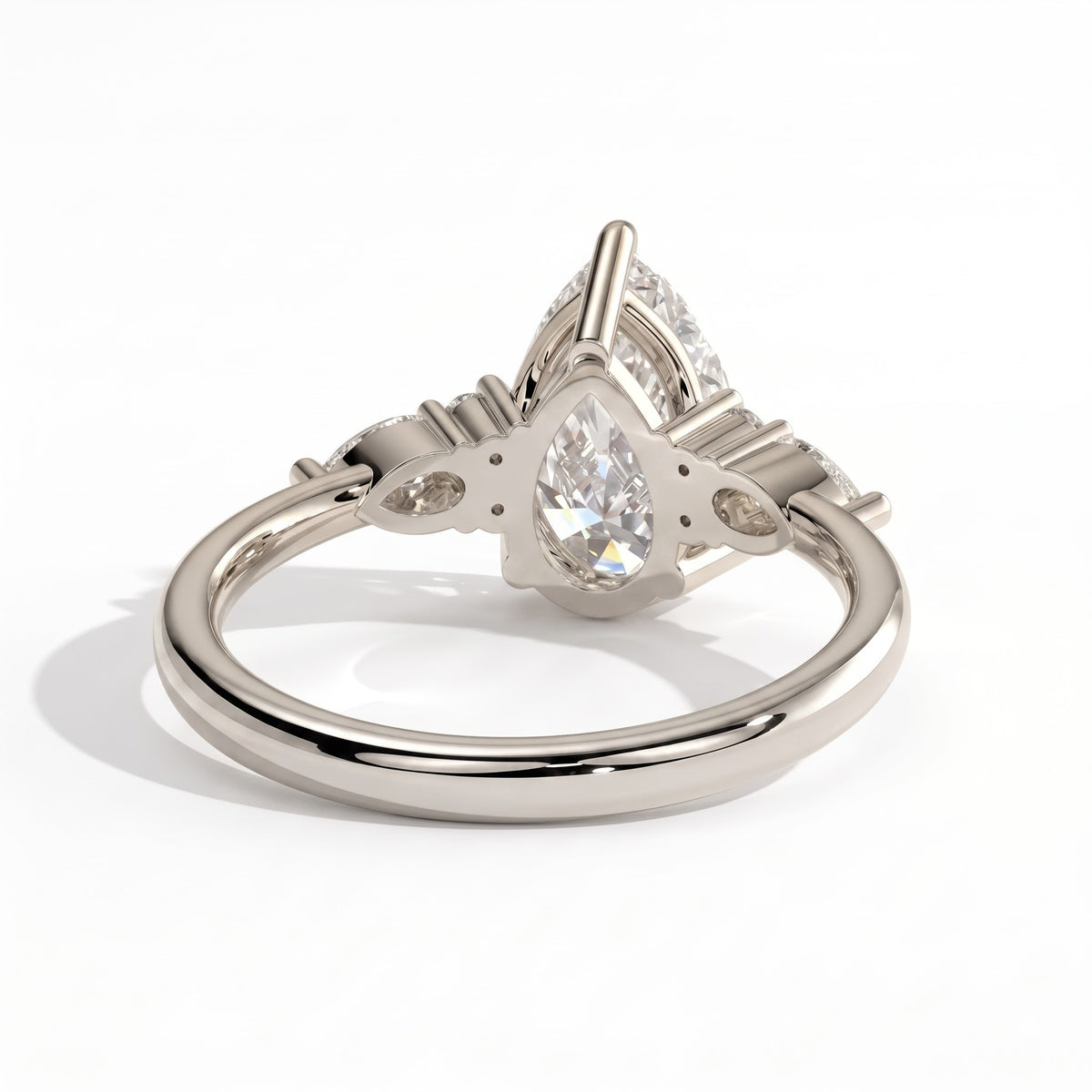 Pear lab-grown diamond halo engagement ring in 14K (585) white gold, on white background 