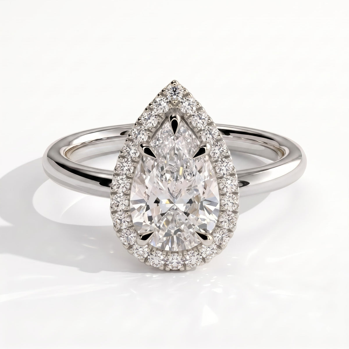Pear lab-grown diamond halo engagement ring in 14K (585) white gold, front view 