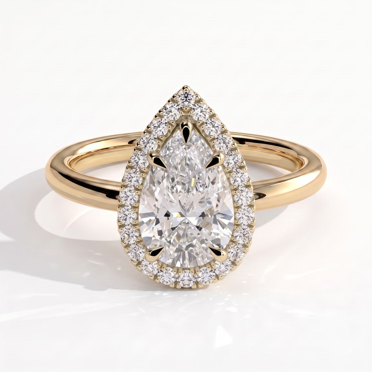 Pear lab-grown diamond halo engagement ring in 18K (750) yellow gold, front view 
