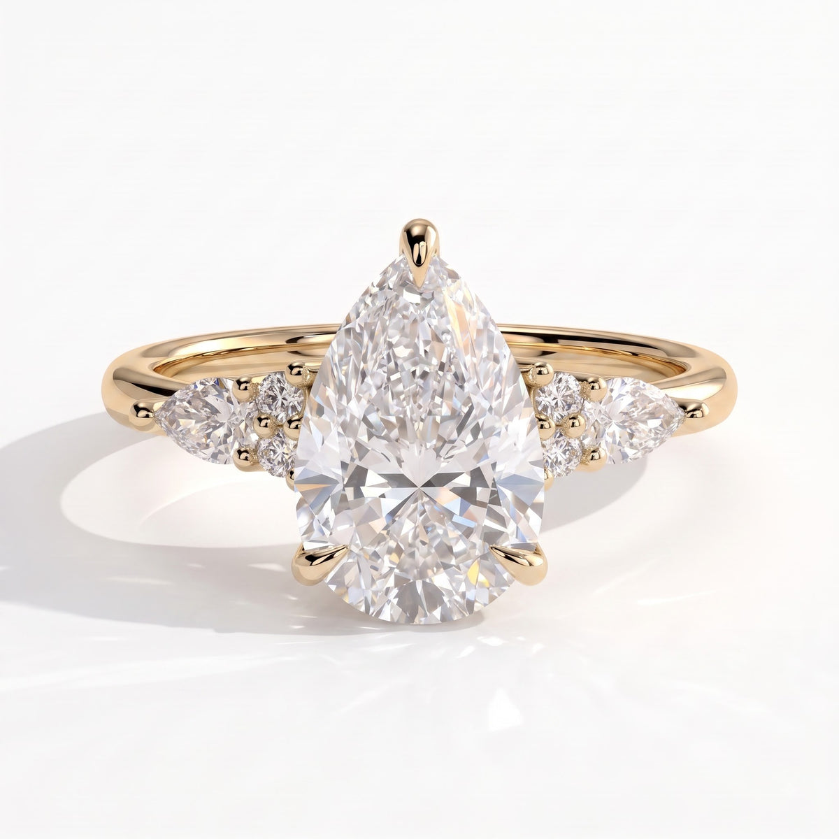 Pear lab-grown diamond halo engagement ring in 18K (750) yellow gold, front view 