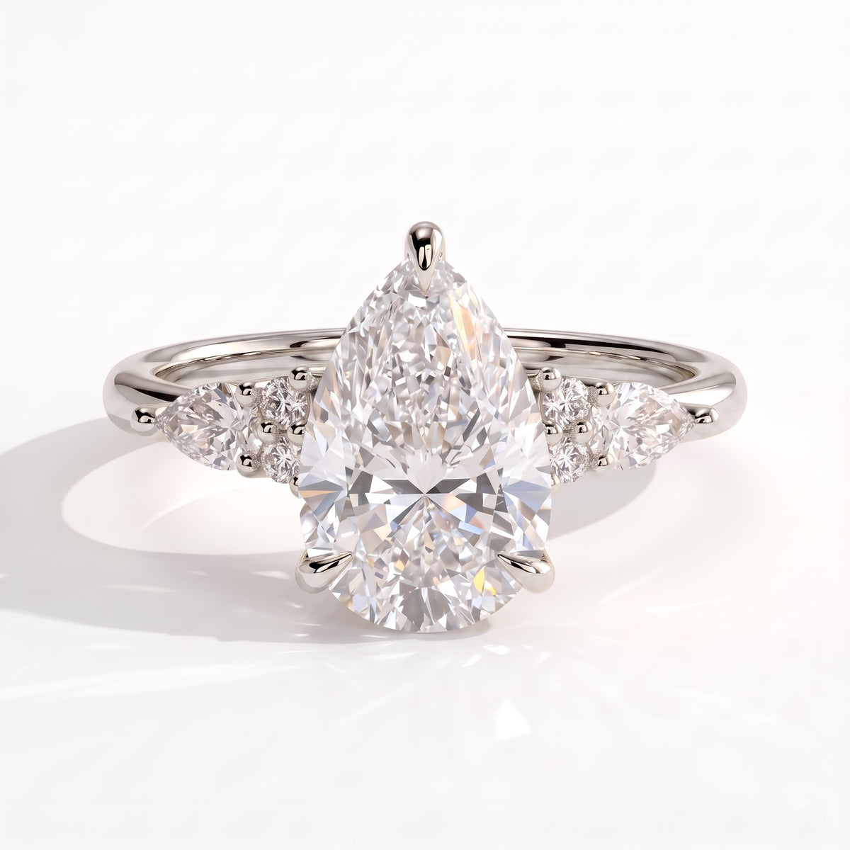 Pear lab-grown diamond halo engagement ring in 18K (750) white gold, front view 