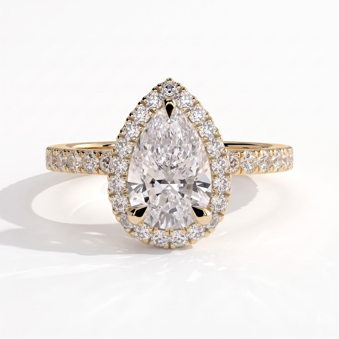 Pear lab-grown diamond halo engagement ring in 14K (585) yellow gold, front view 