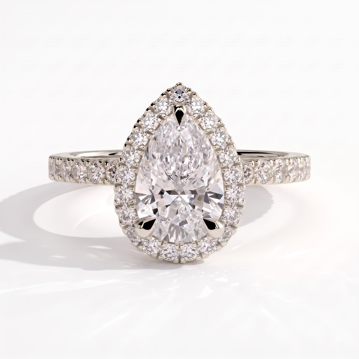 Pear lab-grown diamond halo engagement ring in 950 platinum, front view 