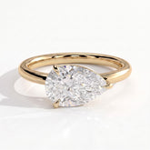 Pear lab-grown diamond east-west solitaire engagement ring in 14K (585) yellow gold, front view 