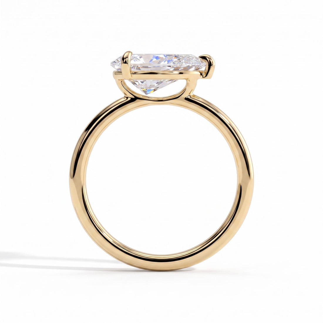 Pear lab-grown diamond east-west solitaire engagement ring in 14K (585) yellow gold, side profile 