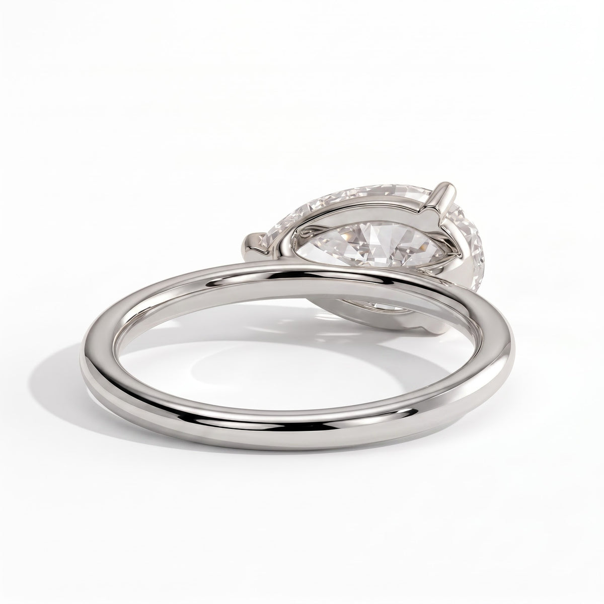 Pear lab-grown diamond east-west solitaire engagement ring in 14K (585) white gold, on white background 