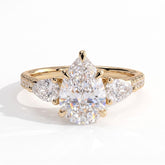 Pear lab-grown diamond three-stone engagement ring in 14K (585) yellow gold, front view 