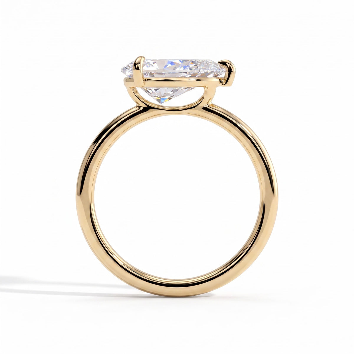 Pear lab-grown diamond east-west solitaire engagement ring in 18K (750) yellow gold, side profile 