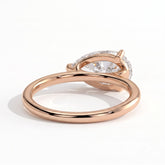 Pear lab-grown diamond east-west solitaire engagement ring in 18K (750) rose gold, on white background 
