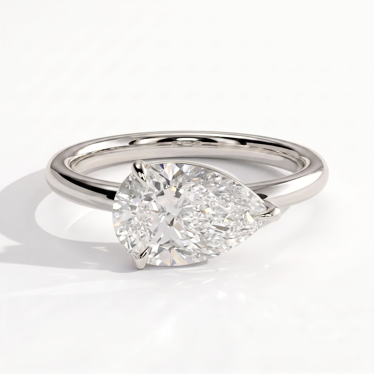 Pear lab-grown diamond east-west solitaire engagement ring in 18K (750) white gold, front view 