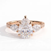 Pear lab-grown diamond three-stone engagement ring in 18K (750) rose gold, front view 