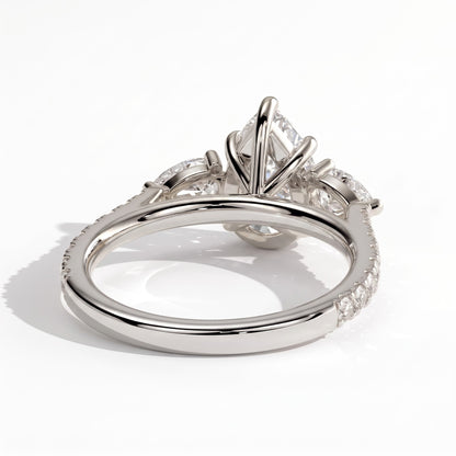 Pear lab-grown diamond three-stone engagement ring in 950 platinum, on white background 