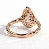 Pear lab-grown diamond halo engagement ring in 14K (585) rose gold, on white background 