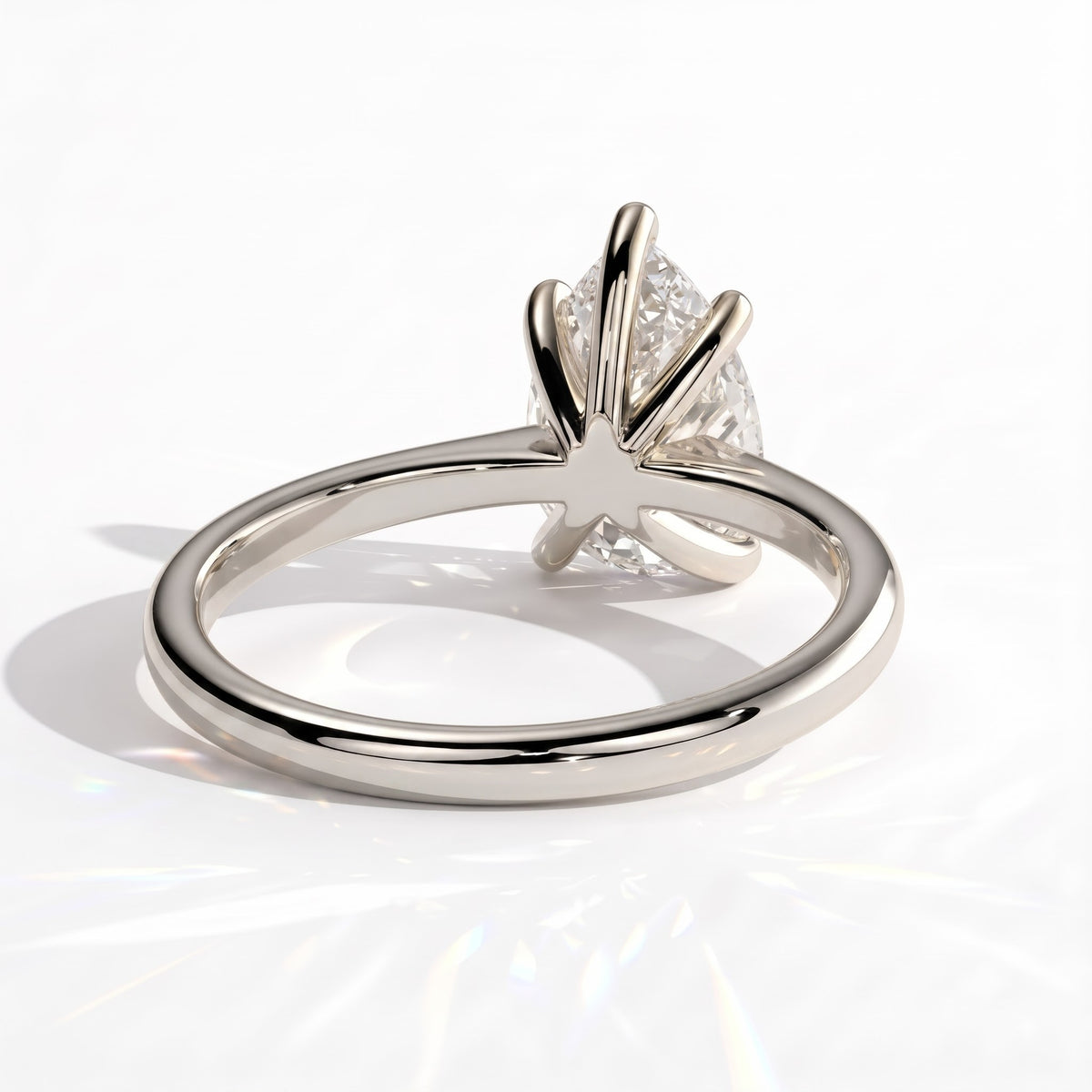 Pear lab-grown diamond solitaire engagement ring in 14K (585) white gold, on white background 